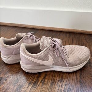 Mauve Nike running shoes